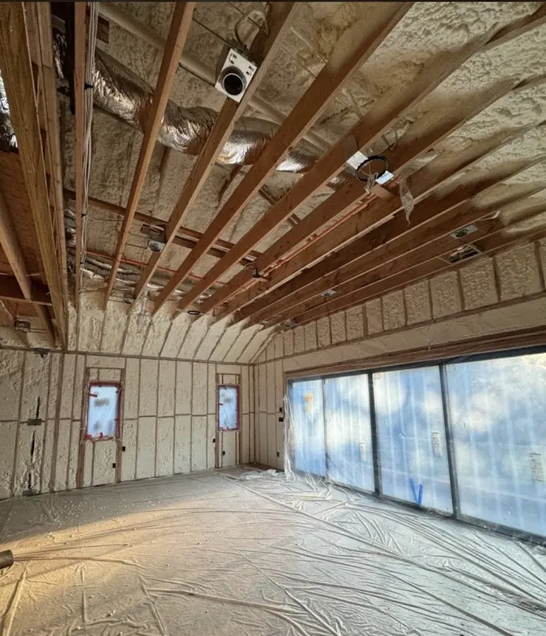 Interior walls and ceiling insulated with spray foam during new construction in Greer